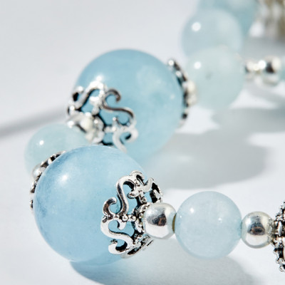 Vòng tay đá hải lam ngọc charm hồng hạc Ngọc Quý Gemstones